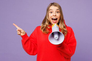 Young blonde woman wears red hoody casual clothes hold in hand megaphone scream announces discounts...