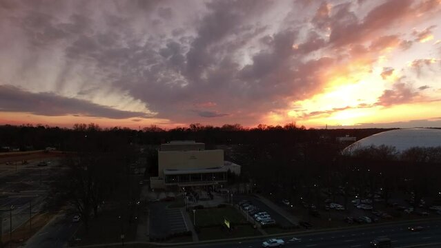 Aerial Shot Of Bojangles Coliseum And Ovens Auditorium Drone Ascending Backwards During Sunset - Charlotte, North Carolina