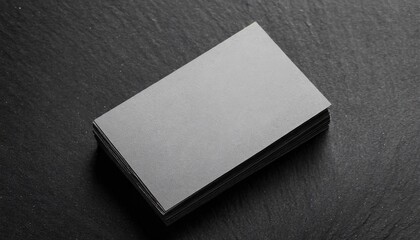 mockup of blank business card at black textured background
