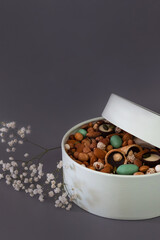 Peanuts in box. Gift to Women's Day (8 March), Women's Day. Mother's Day Valentines day. Festive round box.