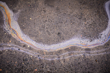 A colorful stain of engine oil on the road.