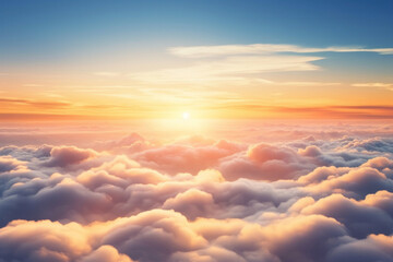 Aerial view of Beautiful sunrise sky above clouds or fog with dramatic light at dawn.