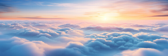 Aerial view of Beautiful sunrise sky above clouds or fog with dramatic light at dawn.