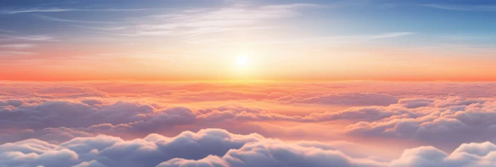  Aerial view of Beautiful sunrise sky above clouds or fog with dramatic light at dawn. © Wararat
