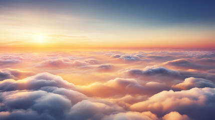 Aerial view of Beautiful sunrise sky above clouds or fog with dramatic light at dawn.