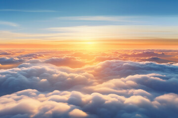 Aerial view of Beautiful sunrise sky above clouds or fog with dramatic light at dawn.