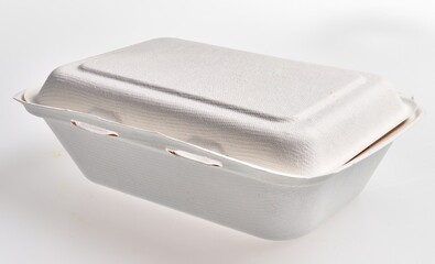 A single-use biodegradable food container on a white background, suggesting eco-friendly packaging.