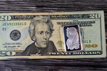 USD American 20 dollars cash money and silver precious metal ounce bar of pure silver, The price of...