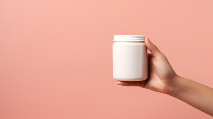 Female hand holds jar of cream on pastel pink background. Body and hand care concept. Blank mockup of cosmetic products, with space for text. AI Generative