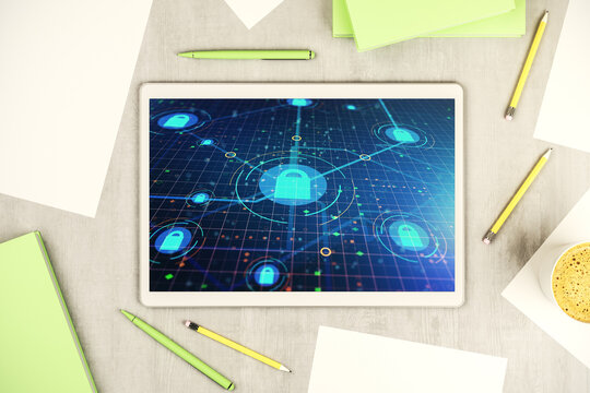 Top view of modern digital tablet monitor with creative lock hologram and chip. Information security concept. 3D Rendering