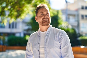 Young caucasian man smiling confident looking to the sky at park