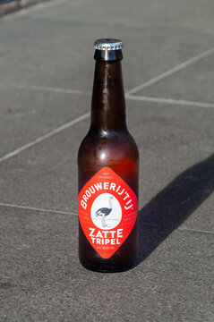 Rotterdam, Nederland - October 22, 2023: Bottle of Zatte Tripel beer.