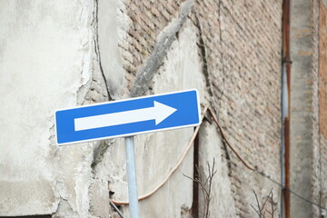 arrow traffic sign on a wall
