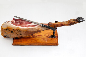 Piece of black leg Iberian ham on cutting board