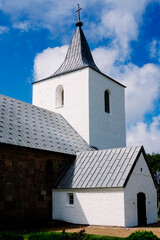 A serene vintage Protestant church nestled in the tranquil Danish countryside