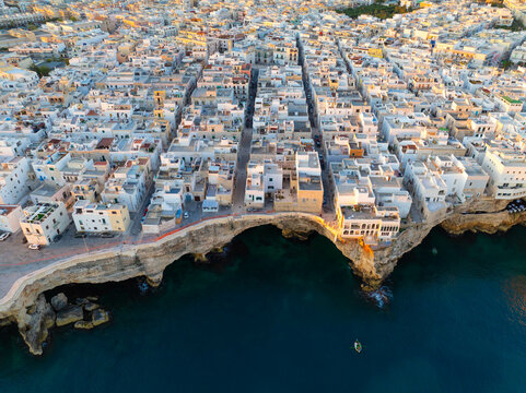The city of Polignano a Mare during sunrise. Aerial view. Puglia, Italy.