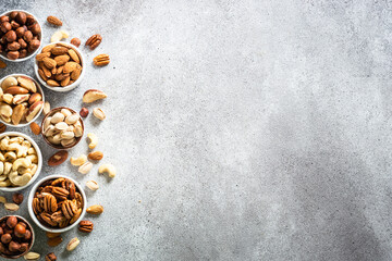 Assortment of nuts in bowls. Cashew, hazelnuts, pecan, almonds, brazilian nuts and pistachios.