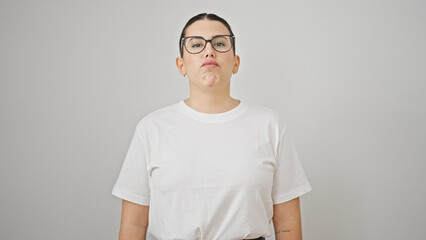 Young beautiful hispanic woman standing with upset expression over isolated white background