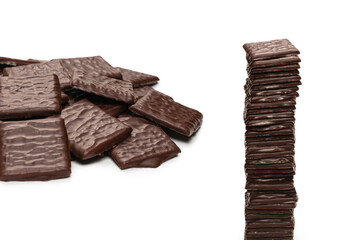 Dark chocolate candies isolated on white background.