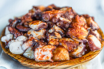 Galician-style octopus dish, served on its typical wooden plate