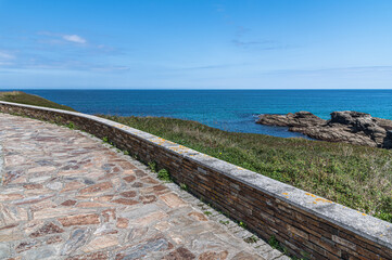 Fototapeta na wymiar Footpath on the shores of the Cantabrian Sea in Foz, Spain
