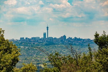 City of Joburg - A skyline of the well known cityscape with a broadcast tower in the centre of the...
