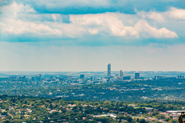 Obraz premium Skyline - view of Sandton - Johannesburg - Gauteng - South Africa - Big business - Corporate - Big sky above with clouds