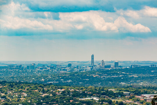 Skyline - view of Sandton - Johannesburg - Gauteng - South Africa - Big business - Corporate - Big sky above with clouds