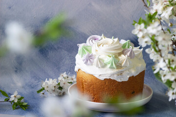 Easter background-easter cake with  spring branches, white blossoms, blue background. Template for easter card, easter banner