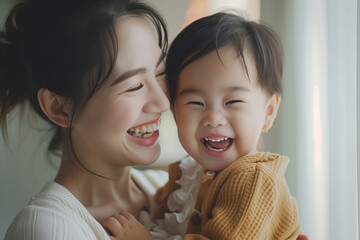 A heartwarming moment as a joyful mother and her giggling child share a laugh in a light-filled room..