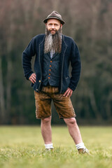 Portrait of a bavarian man wearing a traditional folk costume outdoors