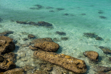 Beautiful views of the beach, sea, rocks during the day.