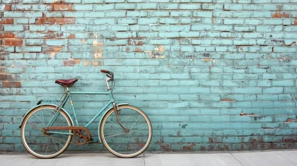 Fototapeten Retro bicycle leaning against a brick wall, symbolizing a slower pace of life and simpler times © ArtCookStudio