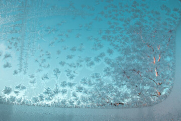 Winter patterns on window glass. The frost on the window froze in intricate patterns. Patterns on...