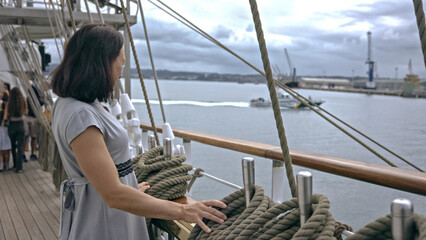 Contemplative Moments: A Sailor Overlooking the Harbor