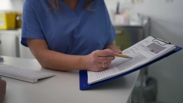 Close up of doctor consulting with overweight patient, discussing test result and x-ray scans in doctor office. Concept of health risks of overwight and obesity.
