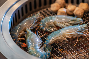 Grilled river prawns on a hot charcoal grill. Grilled prawns,