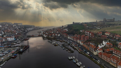Naklejka premium St Mary the Virgin Church and the old ruined abby in the harbor town of Whitby overlooking the famouse whitby harbor.