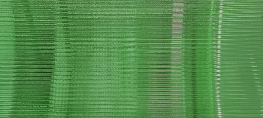 green glass sheet wall or corrugated wall pattern texture use as background. frosted wave glass in...