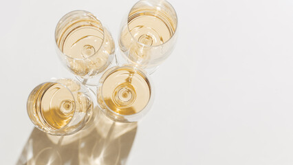 Set of glasses of white wine at wine tasting, Minimal trend concept. Top view shiny wineglass on...