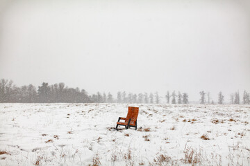 old chair in snowy field