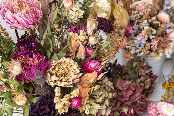 Dried flowers arrangement close up. Sustainable floristry. Home decor with dried flowers.