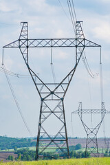 high-voltage power line support on the field. transmission of electricity and information over long...