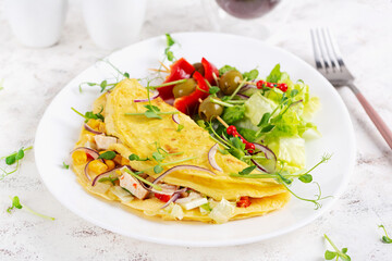 Healthy breakfast.Quesadilla with omelette, chicken fillet, corn and fresh salad. Keto, ketogenic lunch.