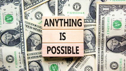 Anything is possible symbol. Concept words Anything is possible on beautiful wooden blocks. Dollar...