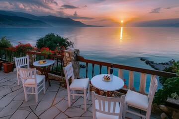 As the sun rises over the tranquil lake, a cozy patio set invites you to sit and take in the breathtaking landscape of the mountains in the distance, with the soft ocean breeze and the vibrant colors
