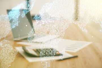 Multi exposure of abstract creative digital world map hologram on blurry calculator with laptop background, research and analytics concept