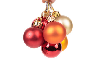 A bunch of Christmas balls on ribbons.