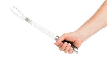A hand holds a barbecue fork.
