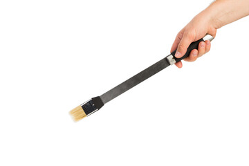 A hand holds a basting brush.